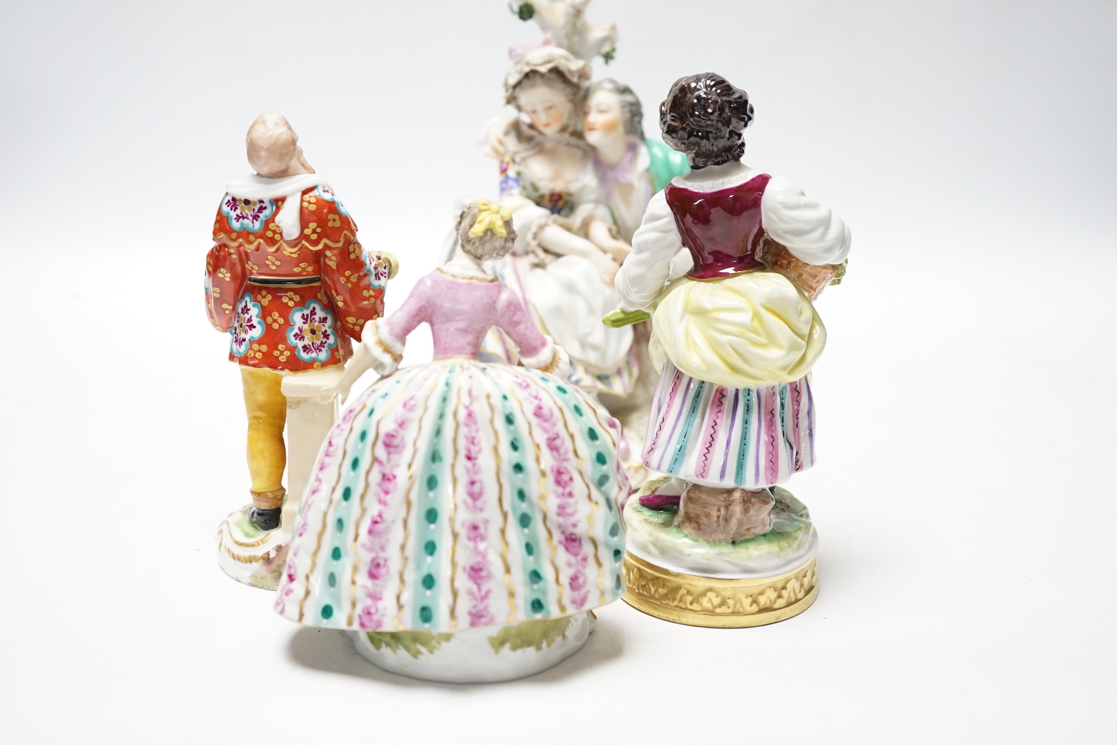 Four Continental porcelain figures or groups, tallest 19cm